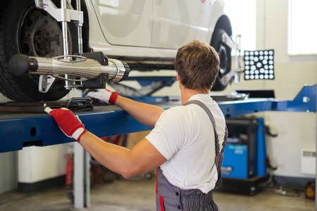 Frame Straightening After a Collision orlando auto body tech working on frame